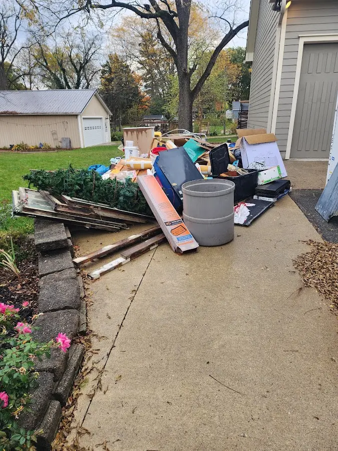 Dumpster being loaded with debris for 12 Yard Dumpster Rental in York
